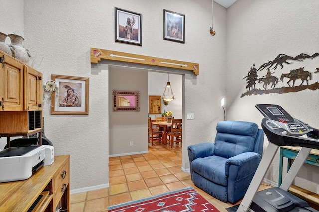 9484 Swansea Ln, West Palm Beach, FL 33411 - home office featuring light tile patterned flooring and a textured wall