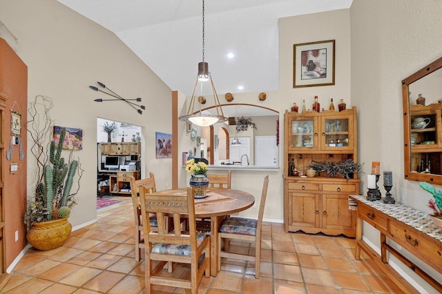 9484 Swansea Ln, West Palm Beach, FL 33411 - dining room featuring high vaulted ceiling and light tile patterned floors