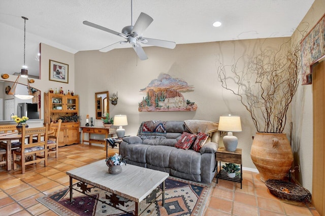 9484 Swansea Ln, West Palm Beach, FL 33411 - living room featuring ceiling fan, light tile patterned floors, and vaulted ceiling