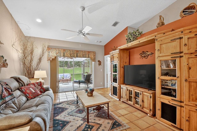 9484 Swansea Ln, West Palm Beach, FL 33411 - living room with light tile patterned floors, a ceiling fan, and a textured ceiling