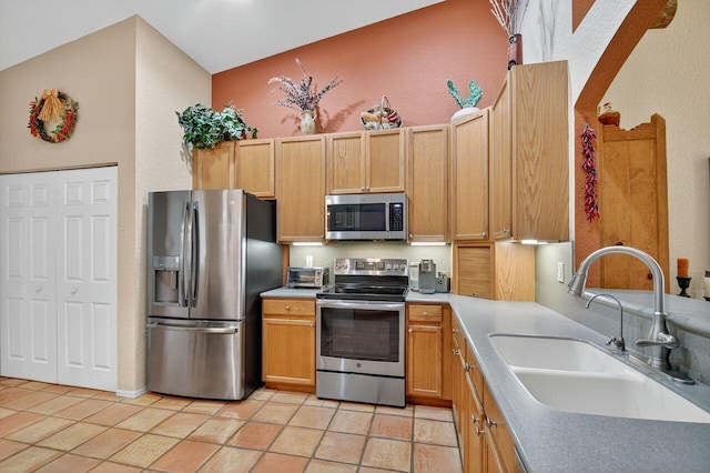 9484 Swansea Ln, West Palm Beach, FL 33411 - kitchen featuring appliances with stainless steel finishes, light tile patterned flooring, and light countertops