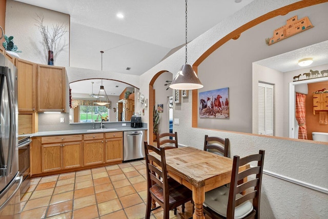 9484 Swansea Ln, West Palm Beach, FL 33411 - dining room featuring arched walkways and vaulted ceiling