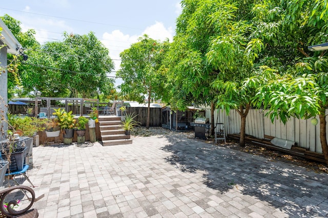 4740 NE 17th Ave, Pompano Beach, FL 33064 - fenced backyard with a patio area and a wooden deck