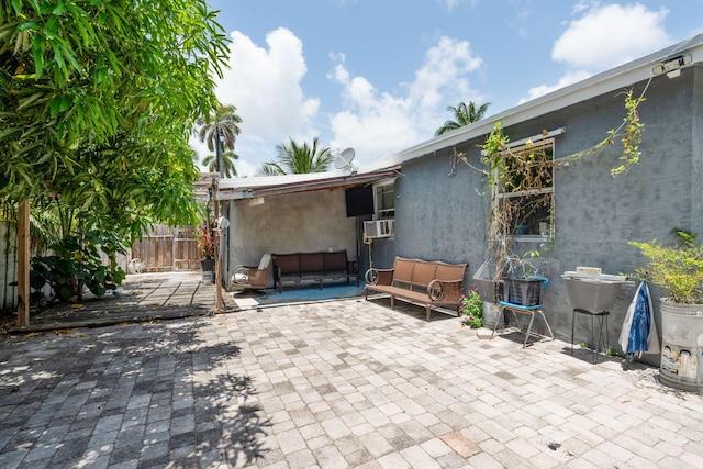 4740 NE 17th Ave, Pompano Beach, FL 33064 - view of patio with cooling unit and an outdoor living space