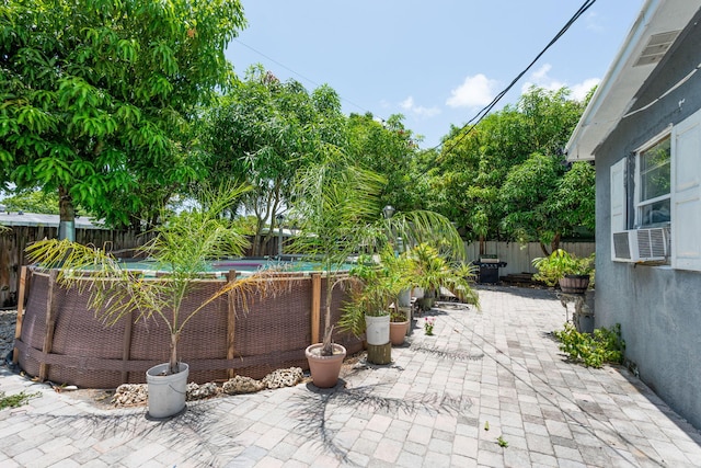 4740 NE 17th Ave, Pompano Beach, FL 33064 - fenced backyard featuring cooling unit and a patio area