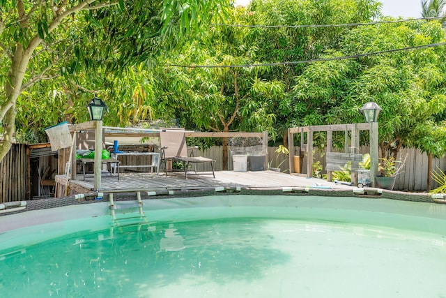 4740 NE 17th Ave, Pompano Beach, FL 33064 - view of swimming pool featuring a wooden deck