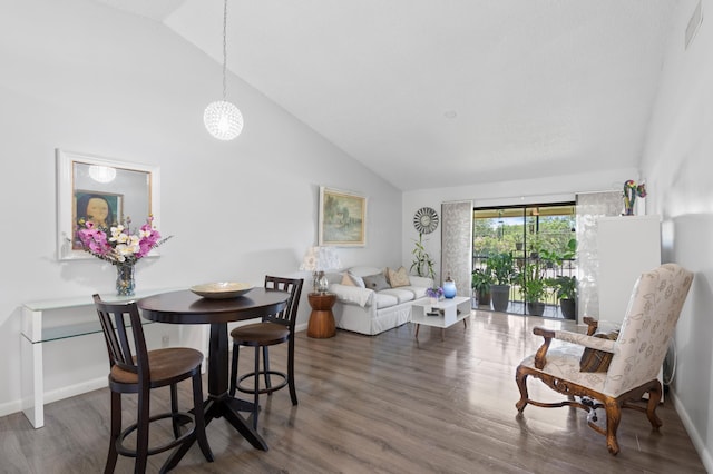 22100 Palms Way Unit 204, Boca Raton, FL 33433 - dining area featuring wood finished floors and high vaulted ceiling