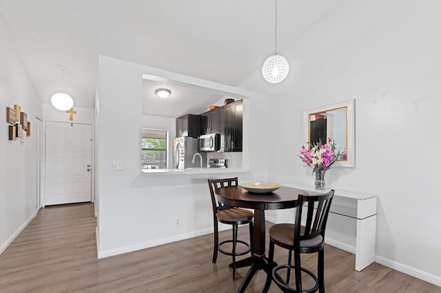 22100 Palms Way Unit 204, Boca Raton, FL 33433 - dining space featuring light wood-style floors and a chandelier