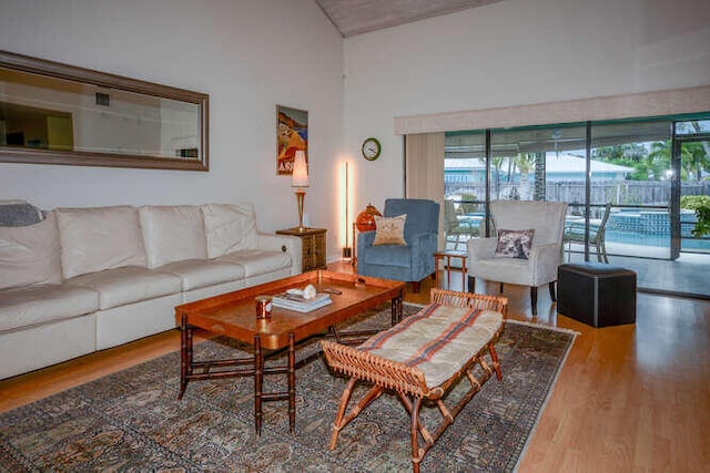 45 Birch Pl, Tequesta, FL 33469 - living area with wood finished floors and vaulted ceiling