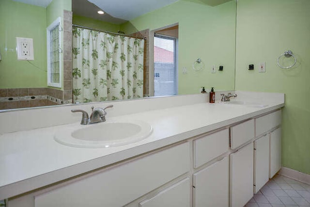 45 Birch Pl, Tequesta, FL 33469 - full bathroom with double vanity, tile patterned floors, and curtained shower