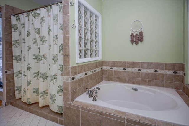 45 Birch Pl, Tequesta, FL 33469 - bathroom featuring a bath, a shower with shower curtain, and tile patterned floors