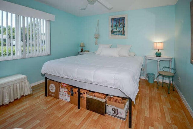 45 Birch Pl, Tequesta, FL 33469 - bedroom with wood finished floors and a ceiling fan