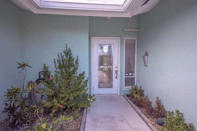 45 Birch Pl, Tequesta, FL 33469 - view of exterior entry with stucco siding