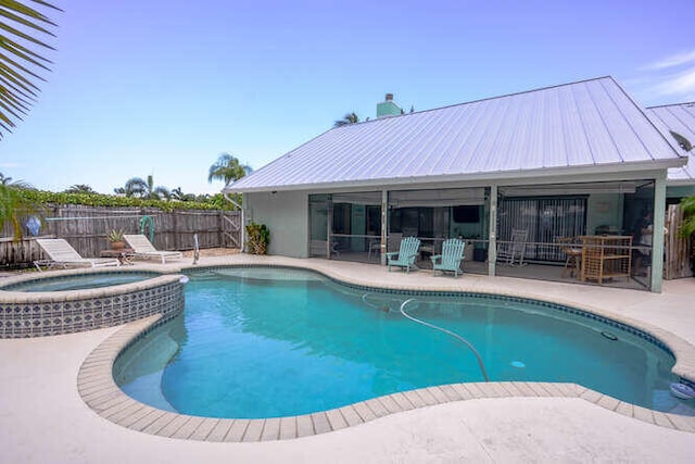 45 Birch Pl, Tequesta, FL 33469 - view of swimming pool featuring a patio area and a pool with connected hot tub