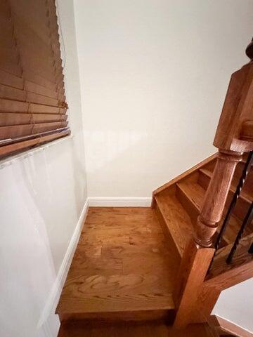 17464 SW 47th Ct, Miramar, FL 33029 - staircase with baseboards and wood finished floors