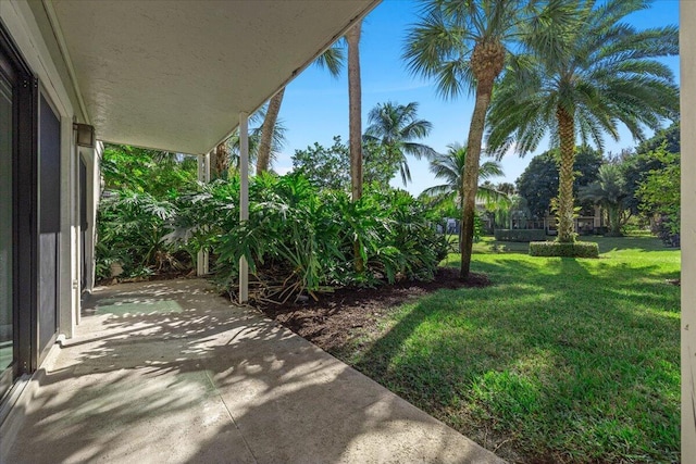 11863 Wimbledon Cir Unit 438, Wellington, FL 33414 - view of grassy yard with a patio area