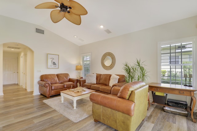 2000 SW Oakwater Pt, Palm City, FL 34990 - living area featuring arched walkways, light wood-style flooring, lofted ceiling, and a ceiling fan