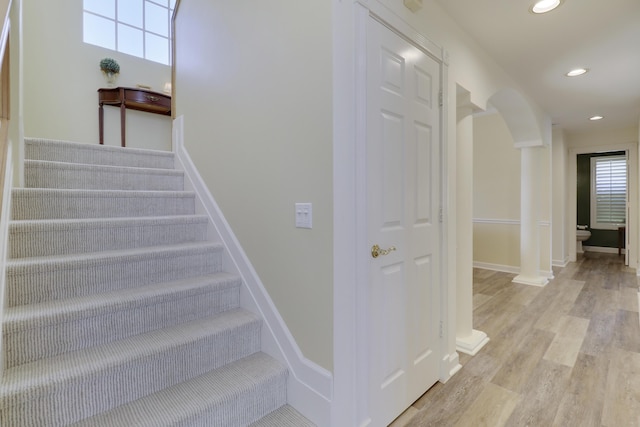 2000 SW Oakwater Pt, Palm City, FL 34990 - staircase featuring recessed lighting, wood finished floors, and arched walkways