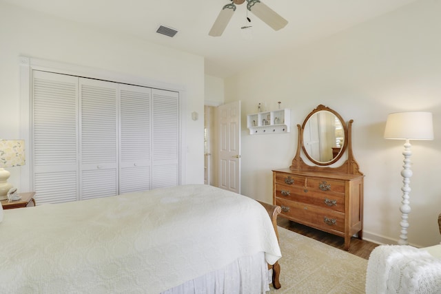 2000 SW Oakwater Pt, Palm City, FL 34990 - bedroom featuring wood finished floors, a closet, and a ceiling fan