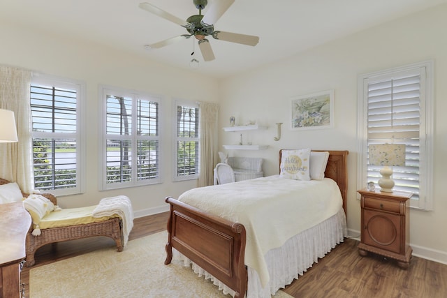 2000 SW Oakwater Pt, Palm City, FL 34990 - bedroom featuring wood finished floors and a ceiling fan