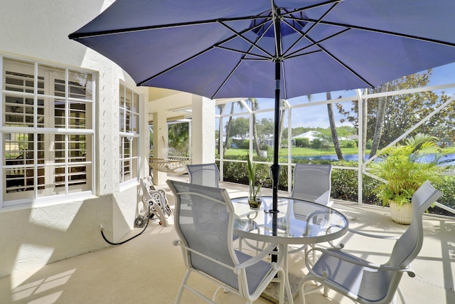 2000 SW Oakwater Pt, Palm City, FL 34990 - sunroom / solarium with outdoor dining area and a water view