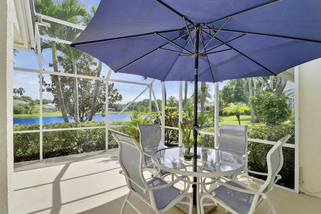 2000 SW Oakwater Pt, Palm City, FL 34990 - sunroom featuring a water view and outdoor dining area