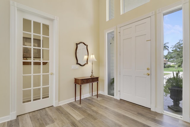 2000 SW Oakwater Pt, Palm City, FL 34990 - foyer entrance with wood finished floors and healthy amount of natural light