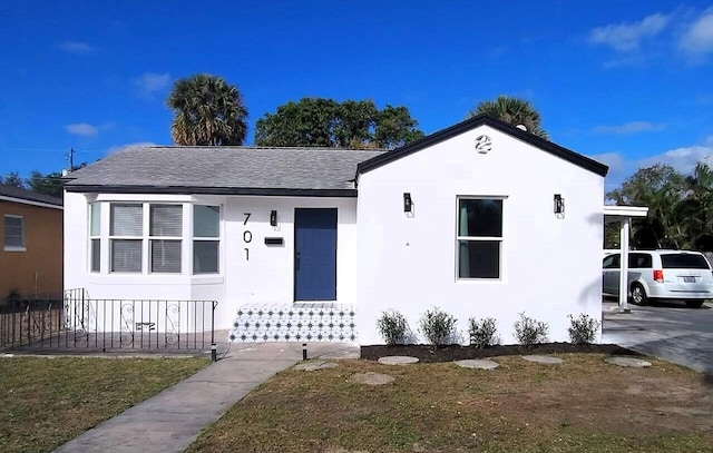 701 37th St, West Palm Beach, FL 33407 - view of front of property featuring roof with shingles and stucco siding