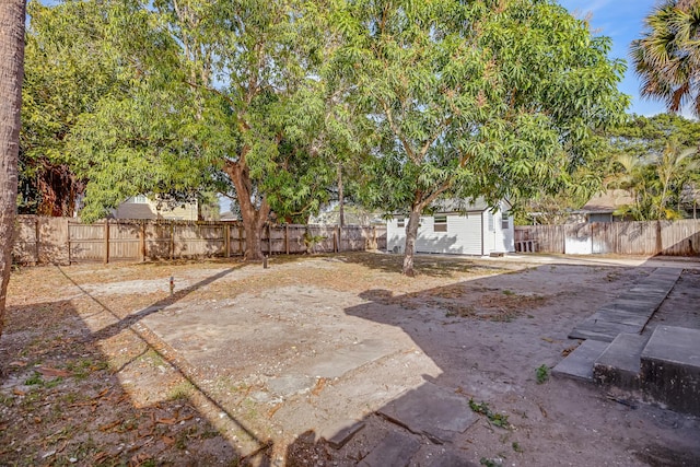 701 37th St, West Palm Beach, FL 33407 - fenced backyard featuring an outbuilding