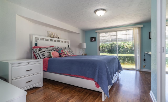 8351 Chisum Trl, Boca Raton, FL 33433 - bedroom with a textured ceiling, dark wood-type flooring, and access to outside
