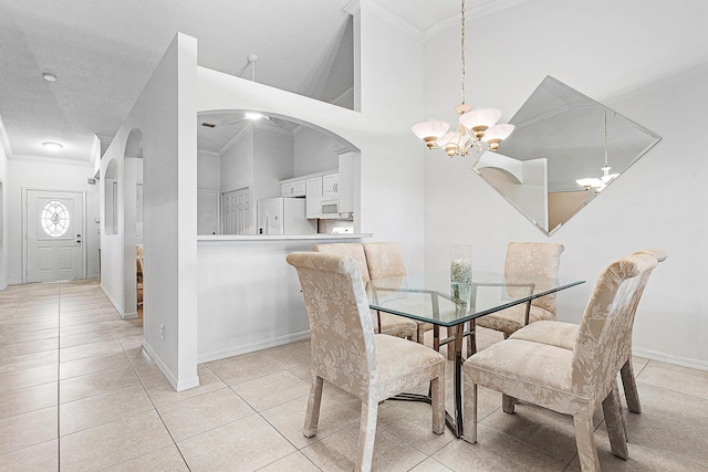 9331 Bridgeport Dr, Royal Palm Beach, FL 33411 - dining area with ornamental molding, a chandelier, arched walkways, light tile patterned flooring, and a textured ceiling