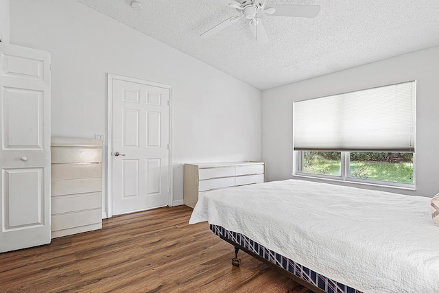 9331 Bridgeport Dr, Royal Palm Beach, FL 33411 - bedroom featuring lofted ceiling, a textured ceiling, wood finished floors, and ceiling fan