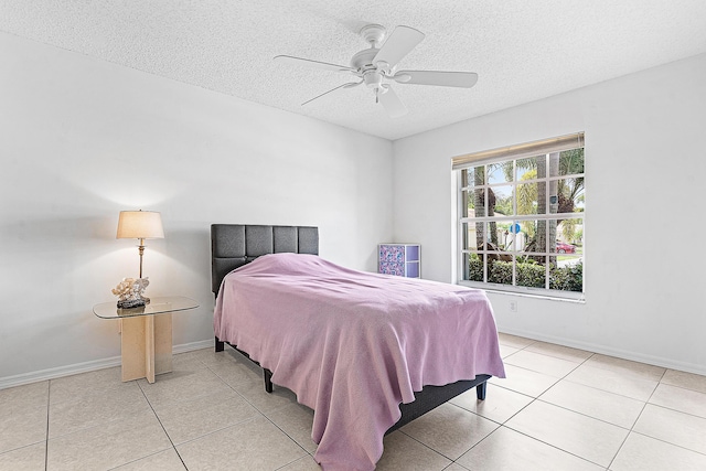 9331 Bridgeport Dr, Royal Palm Beach, FL 33411 - bedroom with light tile patterned floors, a textured ceiling, and ceiling fan