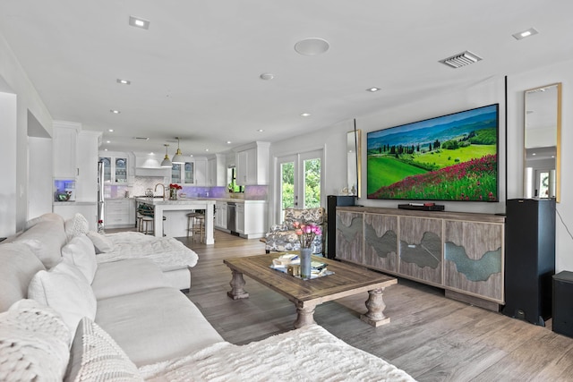 6204 Celadon Cir, Palm Beach Gardens, FL 33418 - living room with light wood-style floors and recessed lighting