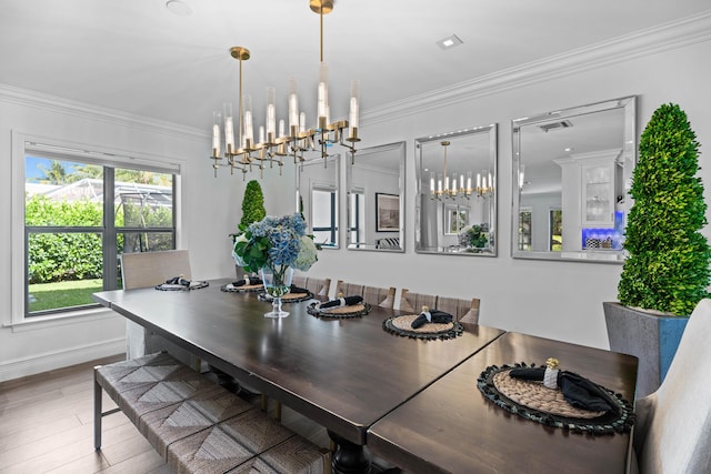 6204 Celadon Cir, Palm Beach Gardens, FL 33418 - dining area featuring a chandelier, wood finished floors, and crown molding