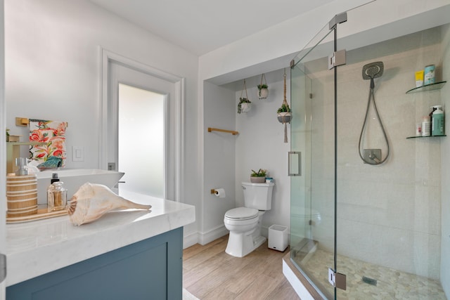 6204 Celadon Cir, Palm Beach Gardens, FL 33418 - bathroom featuring a shower stall, vanity, and wood finished floors