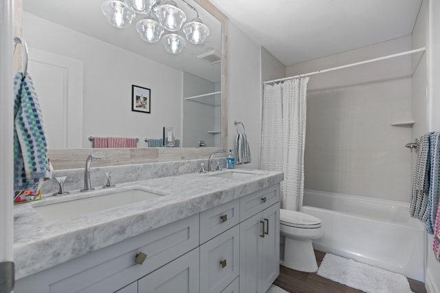 6204 Celadon Cir, Palm Beach Gardens, FL 33418 - bathroom featuring double vanity, shower / bath combo with shower curtain, and wood finished floors