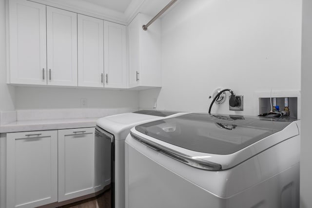 6204 Celadon Cir, Palm Beach Gardens, FL 33418 - laundry room with cabinet space, washing machine and clothes dryer, and dark wood finished floors