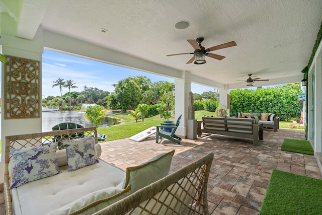 6204 Celadon Cir, Palm Beach Gardens, FL 33418 - view of patio / terrace featuring outdoor lounge area, a water view, a ceiling fan, and area for grilling