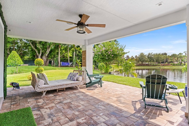 6204 Celadon Cir, Palm Beach Gardens, FL 33418 - view of patio featuring a water view, ceiling fan, and view of wooded area