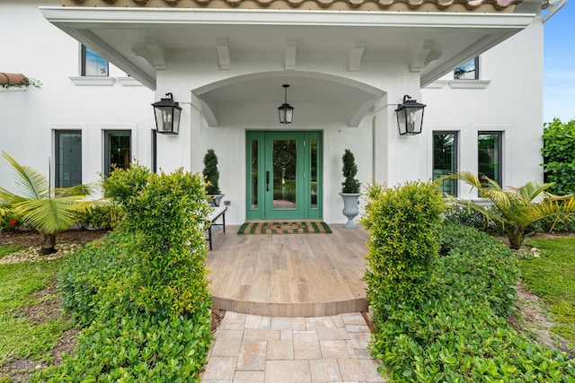 6204 Celadon Cir, Palm Beach Gardens, FL 33418 - doorway to property featuring stucco siding and a tile roof