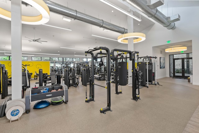 6204 Celadon Cir, Palm Beach Gardens, FL 33418 - workout area with a ceiling fan, a towering ceiling, and french doors