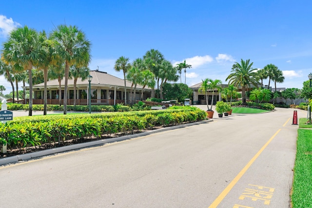 6204 Celadon Cir, Palm Beach Gardens, FL 33418 - view of asphalt street featuring street lights and curbs