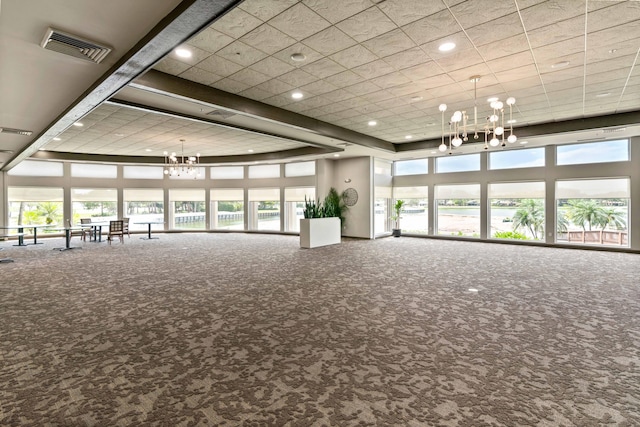 6204 Celadon Cir, Palm Beach Gardens, FL 33418 - carpeted spare room with a chandelier, plenty of natural light, recessed lighting, and a towering ceiling