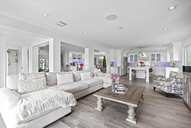 6204 Celadon Cir, Palm Beach Gardens, FL 33418 - living room with healthy amount of natural light, wood finished floors, and recessed lighting