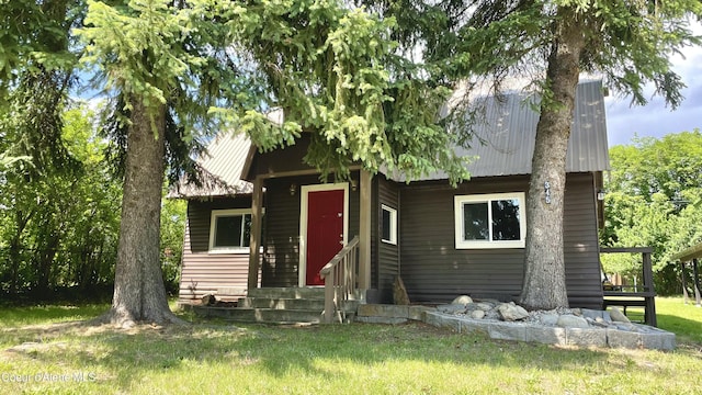 345 E Jefferson, Priest River, ID 83856 - view of front of property featuring metal roof, entry steps, and a front yard
