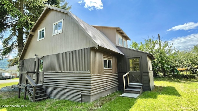 345 E Jefferson, Priest River, ID 83856 - view of side of home featuring entry steps and a lawn