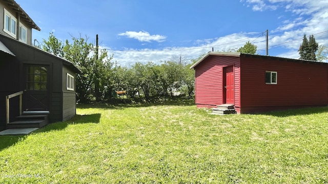 345 E Jefferson, Priest River, ID 83856 - view of green lawn featuring entry steps and an outdoor structure