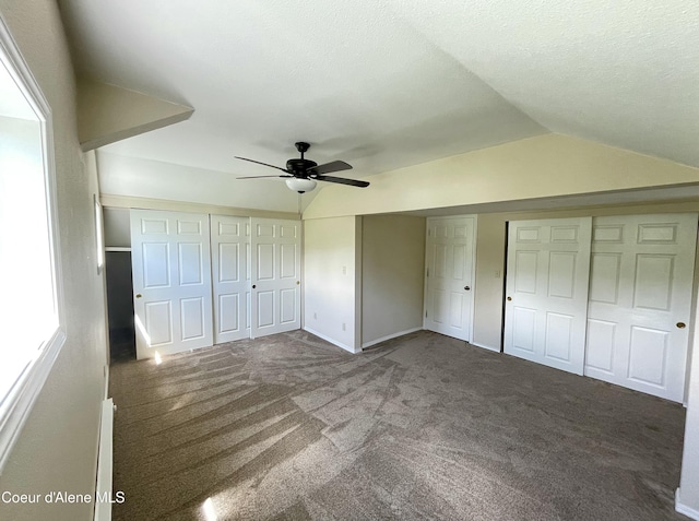 345 E Jefferson, Priest River, ID 83856 - unfurnished bedroom with carpet, lofted ceiling, and a ceiling fan