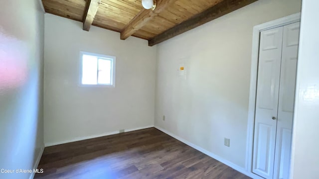 345 E Jefferson, Priest River, ID 83856 - spare room featuring wooden ceiling with exposed beams, dark wood-style floors, and baseboards